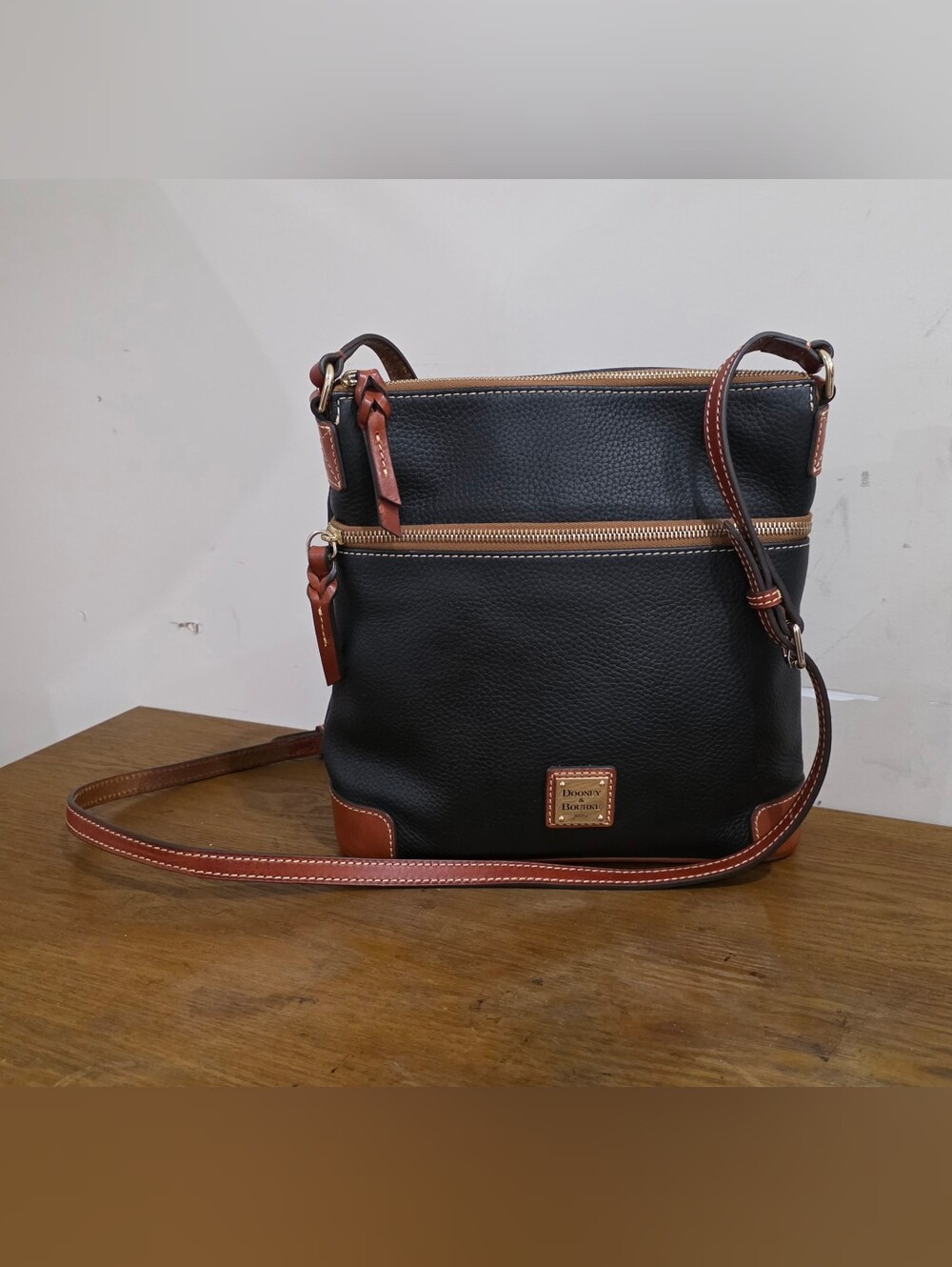 Dooney and bourke Black Pebbled Leather Tan trim Crossbody Bag